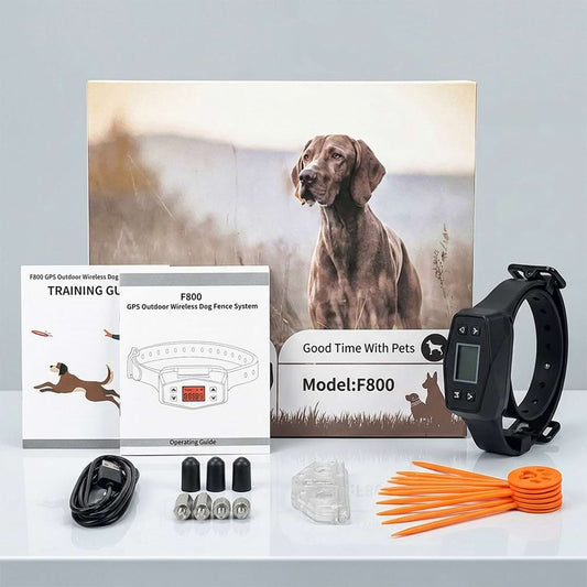 Outdoor wireless dog fence system kit, including the GPS training collar, operating guide, boundary flags, and testing accessories.