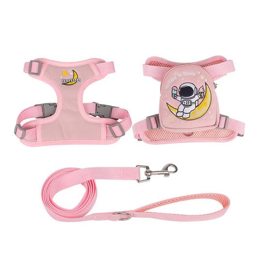 Pink holiday in space puppy backpack with an adjustable harness, perfect for carrying small toys and treats during outdoor adventures.