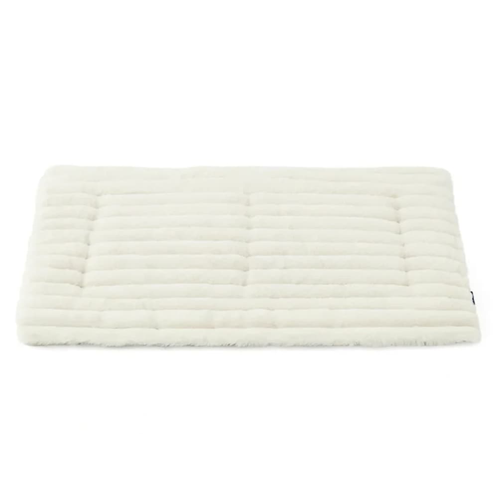 Self Warming Pet Mat in soft cream white, featuring a ribbed plush texture for a cozy thermal cat bed or dog crate pad.