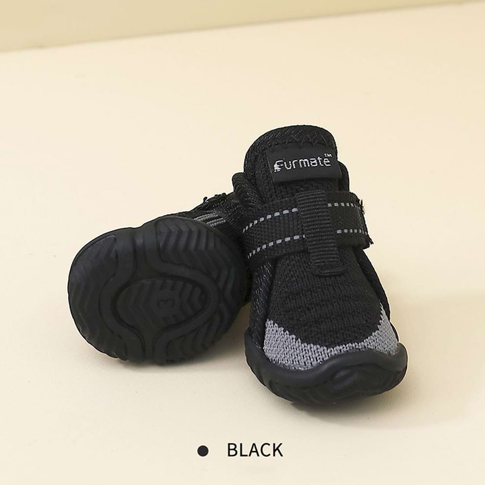 Black Dog Paw Protection boots made from durable fly-knit mesh to keep paws clean and safe on rough terrain.