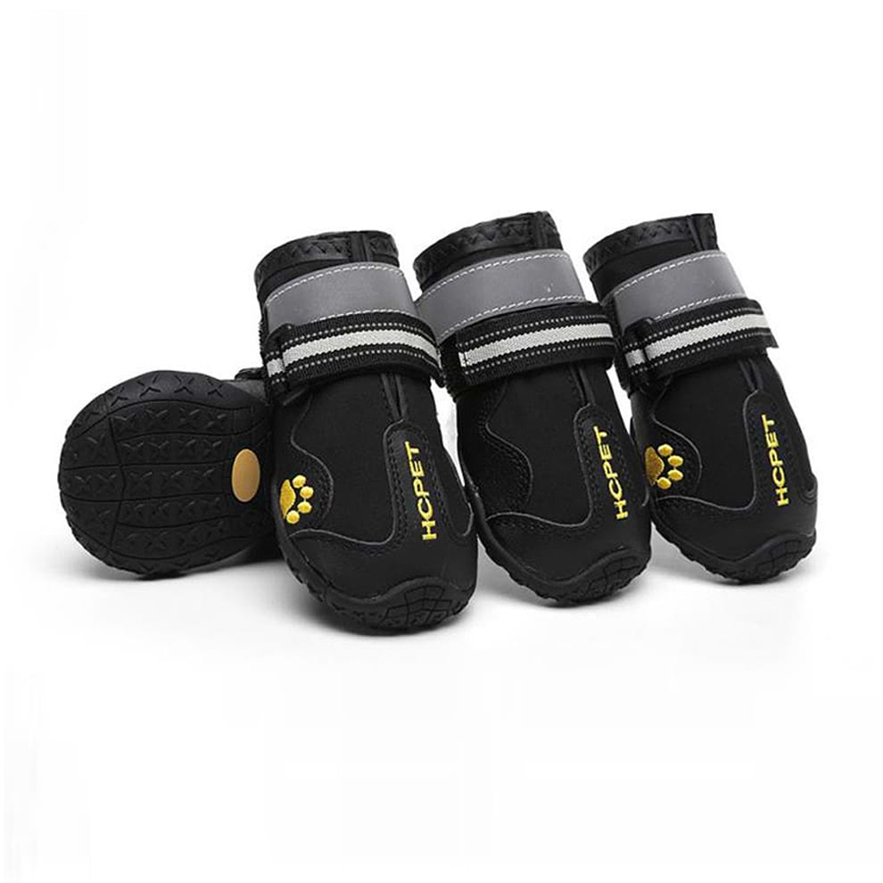 Dog boots for large dogs (Black Trail Edition) featuring waterproof material and rugged soles for hiking on muddy trails.