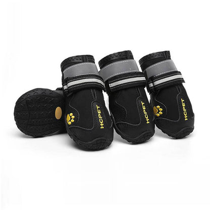 Dog boots for large dogs (Black Trail Edition) featuring waterproof material and rugged soles for hiking on muddy trails.