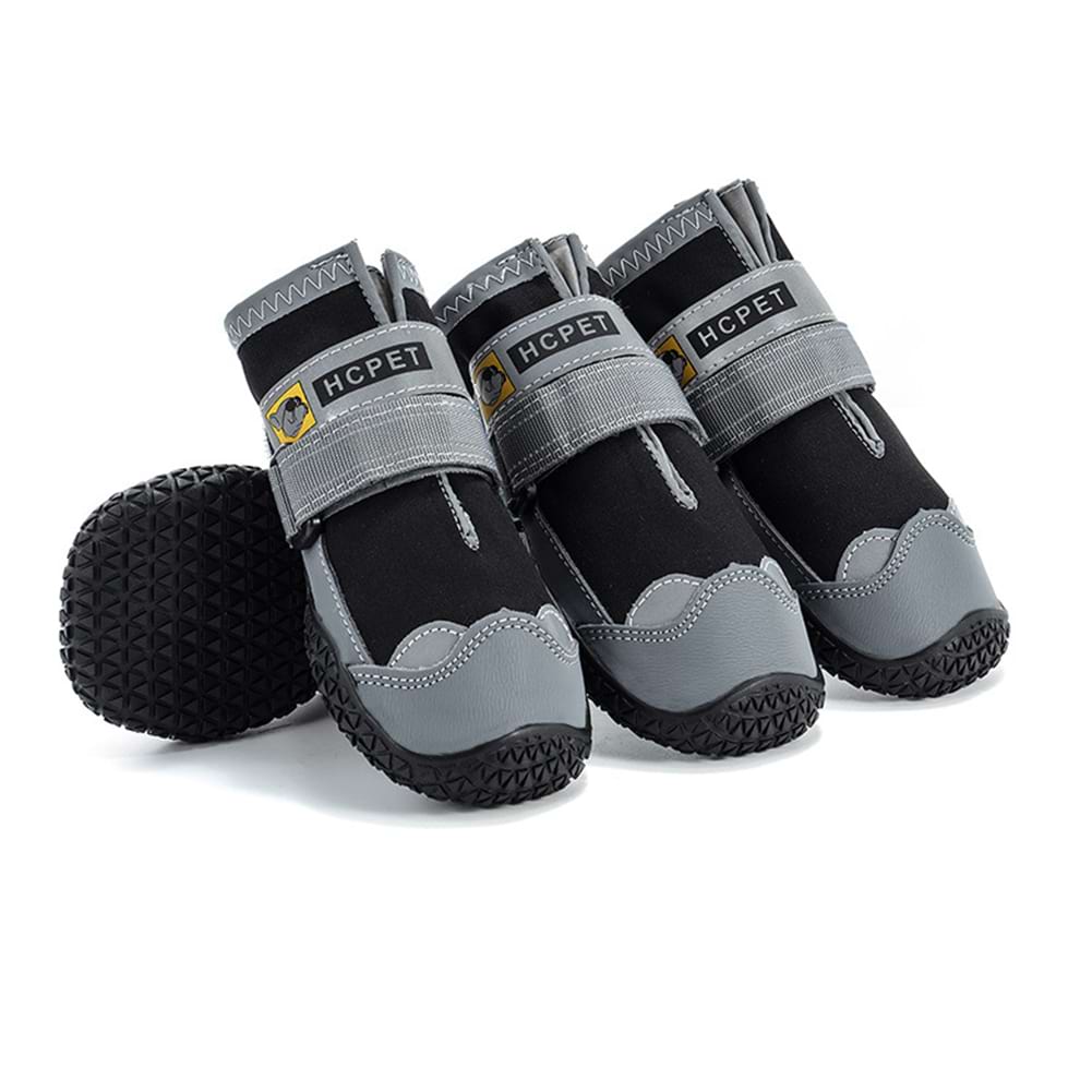 Waterproof dog boots in black, keeping paws dry and clean during rainy walks or muddy hikes.