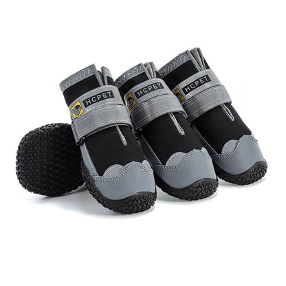 Waterproof dog boots in black, keeping paws dry and clean during rainy walks or muddy hikes.