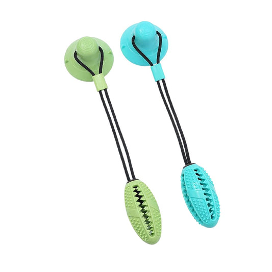 Dog Chew Toys featuring a strong suction cup and a durable football-shaped rubber ball, available in vibrant green and cyan for interactive play.