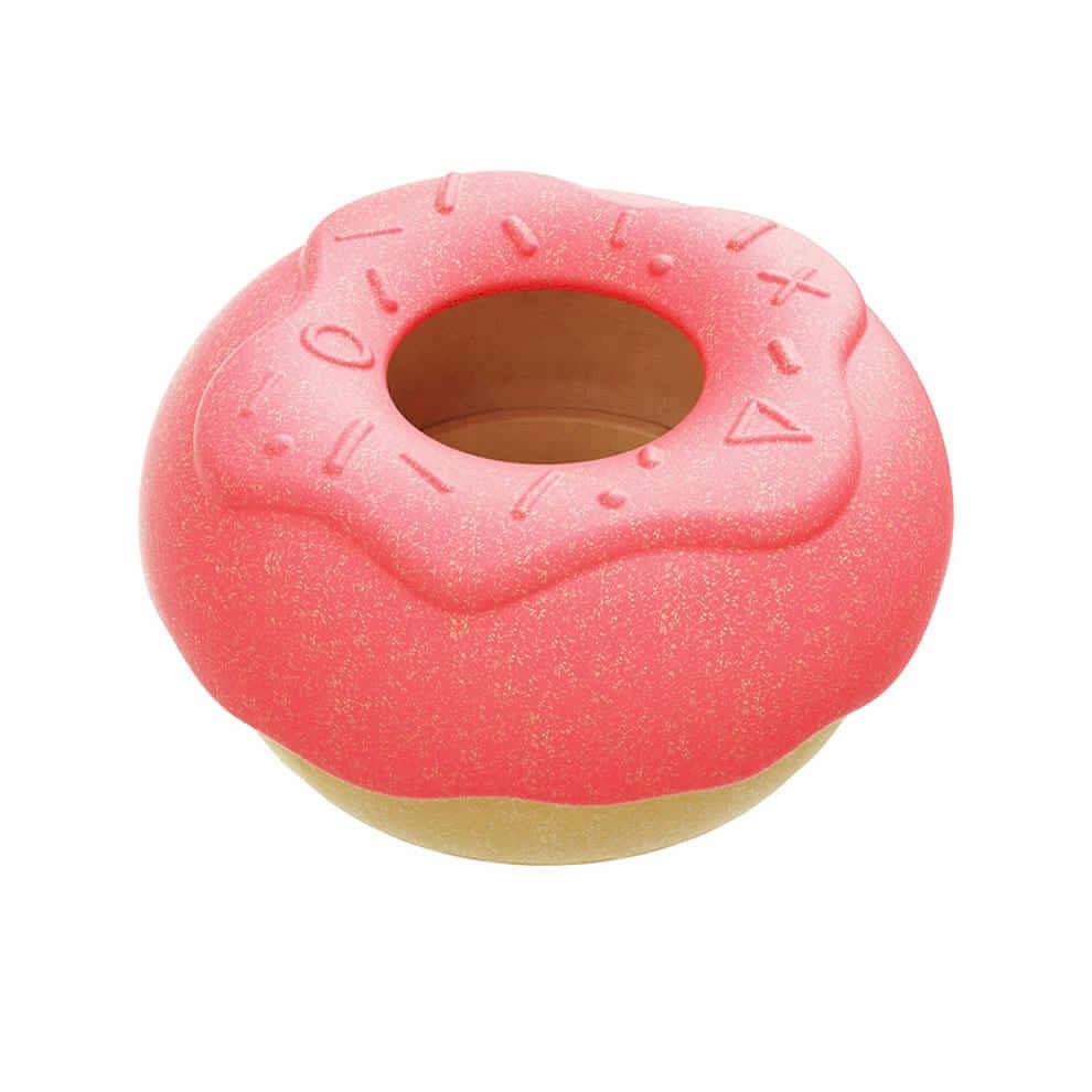 Dog separation anxiety toys shaped like a pink donut with treat dispenser function.