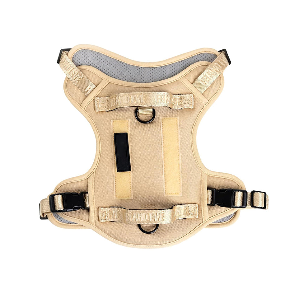 Military dog harness in classic khaki tan, perfect for K9 training and outdoor exploration with secure metal D-rings.