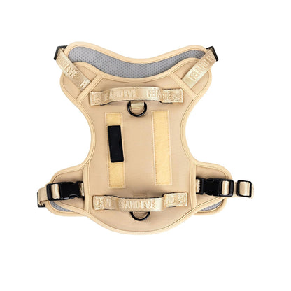Military dog harness in classic khaki tan, perfect for K9 training and outdoor exploration with secure metal D-rings.