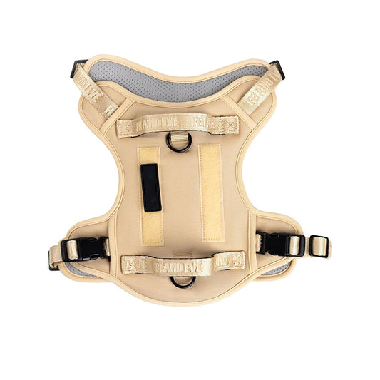 Military dog harness in classic khaki tan, perfect for K9 training and outdoor exploration with secure metal D-rings.