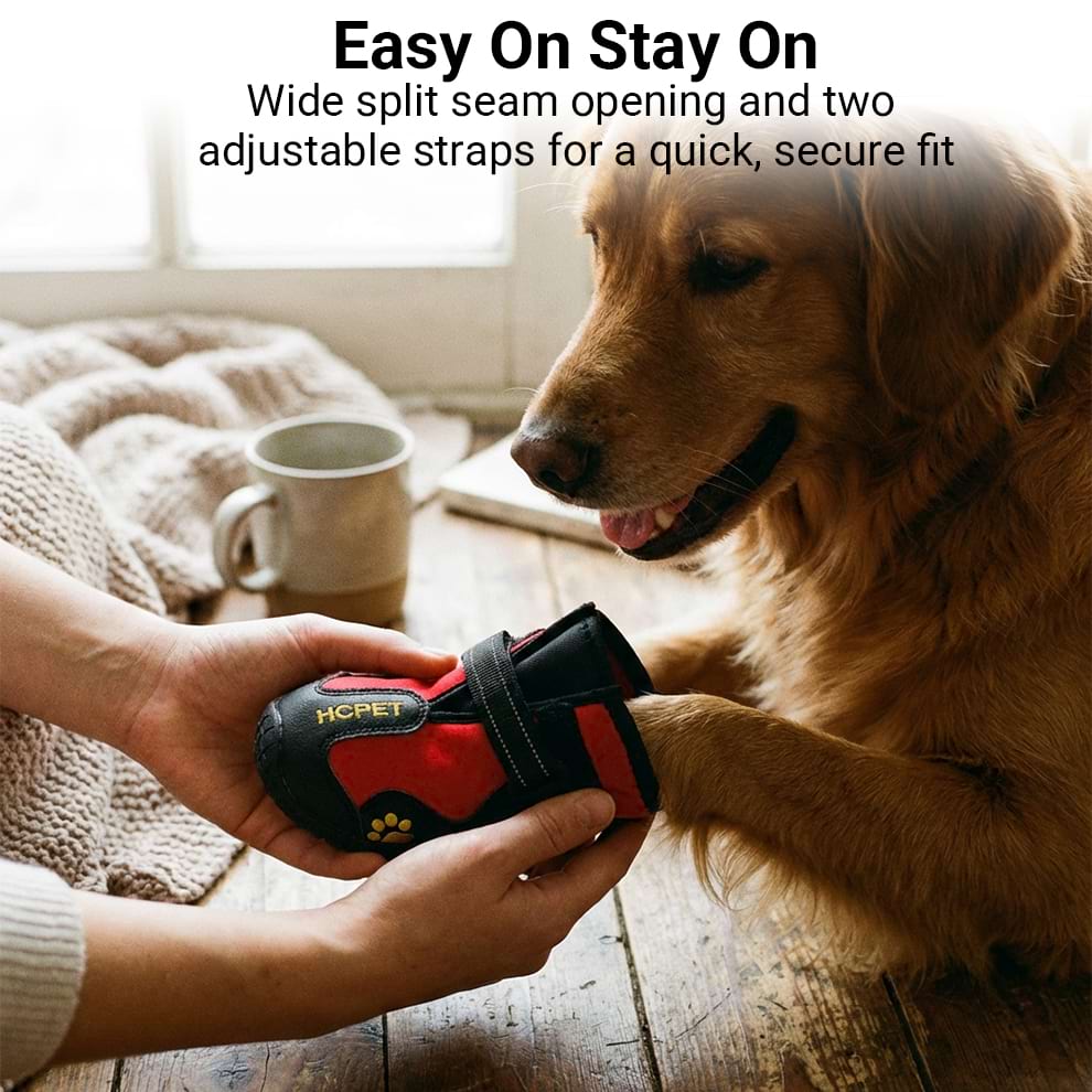 Hand putting on paw protectors for dogs showing the wide split seam opening for easy wear.