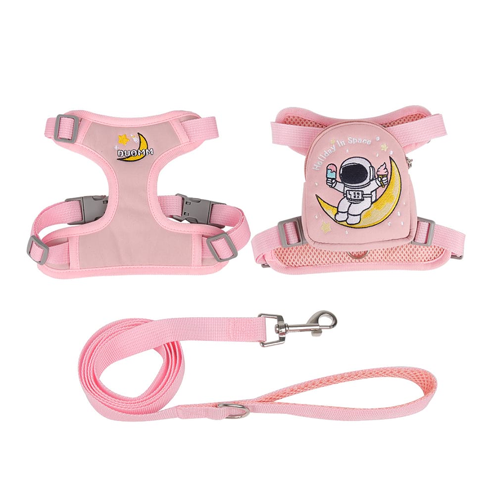 Pink holiday in space puppy backpack with an adjustable harness, perfect for carrying small toys and treats during outdoor adventures.