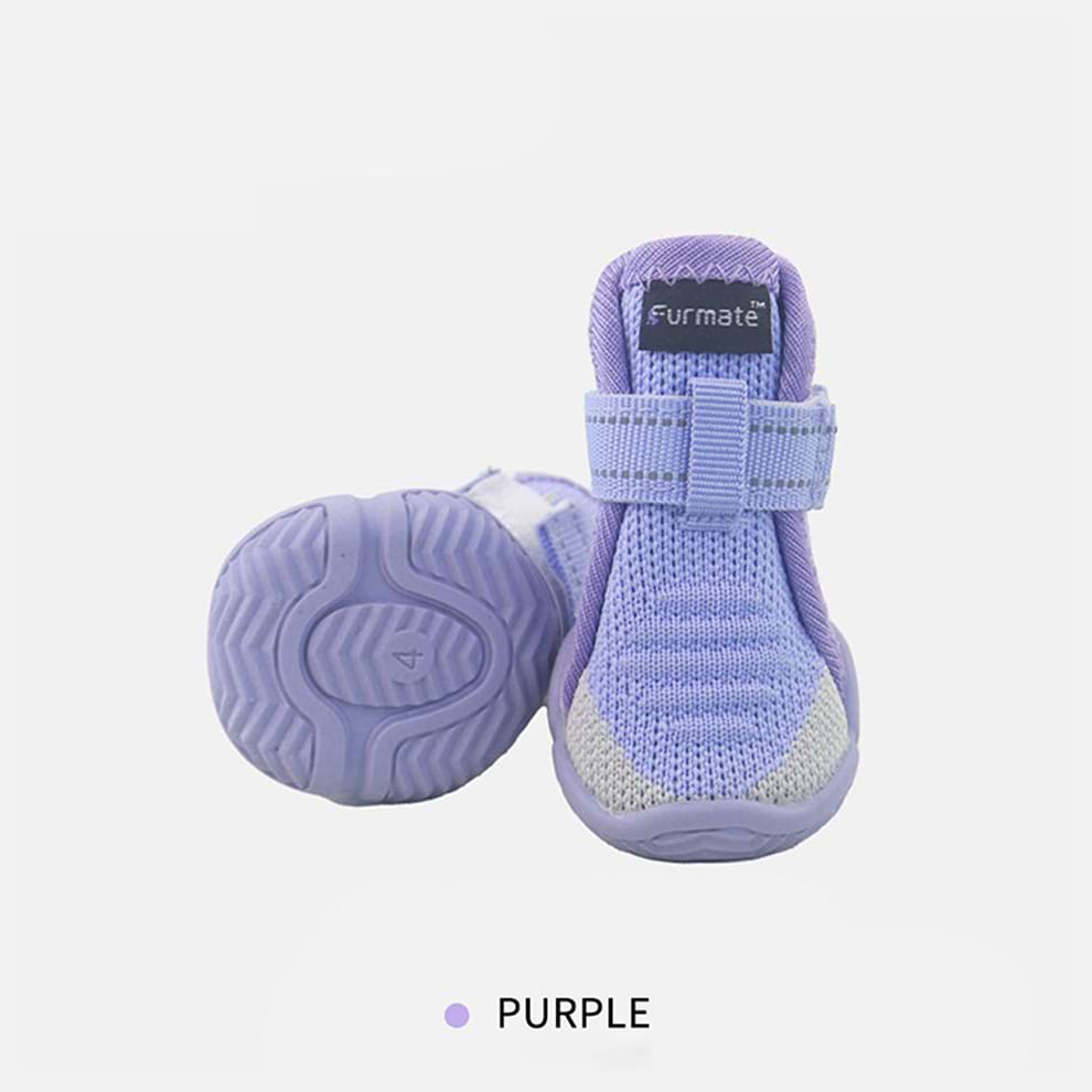 Purple Dog Shoes with non-slip rubber bottoms designed to provide traction and style for small dogs.