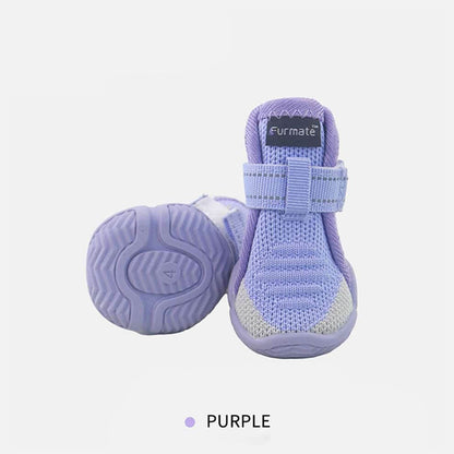 Purple Dog Shoes with non-slip rubber bottoms designed to provide traction and style for small dogs.