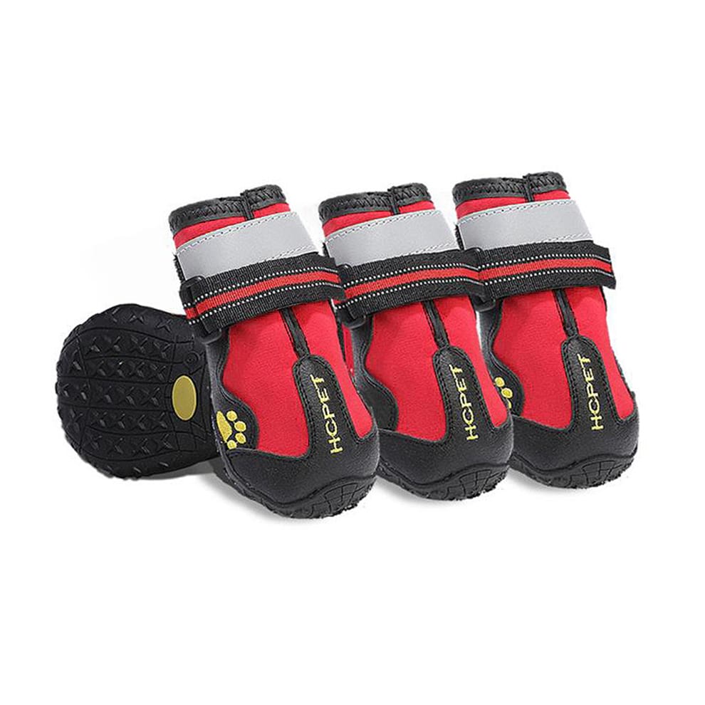 Waterproof dog boots in red, designed to keep paws dry and provide high visibility during outdoor adventures.
