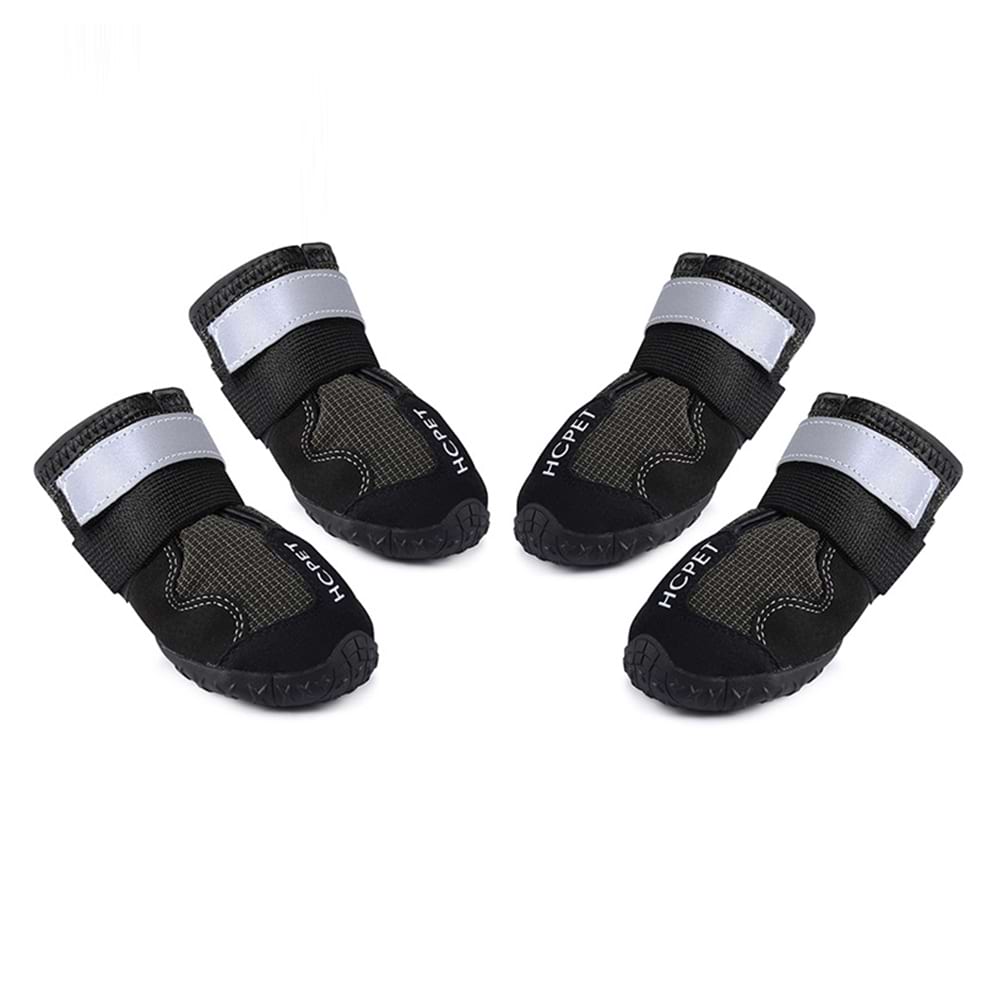 Active dog boots in black featuring double reflective straps and waterproof fabric for safe night walking and running.
