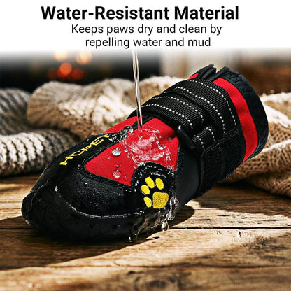 Water being poured on waterproof dog boots for rain, showing liquid repelling off the fabric to keep paws dry.